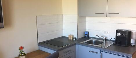 Fridge, stovetop, coffee/tea maker, cookware/dishes/utensils