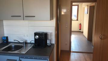 Fridge, stovetop, coffee/tea maker, cookware/dishes/utensils