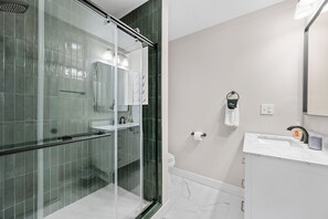 Shower, hair dryer, towels, soap