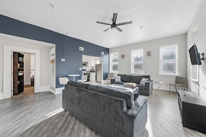 TV, fireplace - Stylish Private 1BR Retreat - Firepit, Walk-In Closet + Laundry, 12-Ft Ceilings (St. Louis)