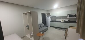 Basic Apartment | Living area | TV - Residencial Marco Zero (Foz do Iguaçu)