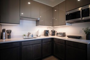 Fridge, microwave, coffee/tea maker, toaster