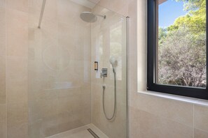 Shower, hair dryer, towels, soap