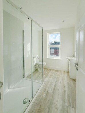 Shower, hair dryer, towels, soap