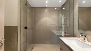 Separate bathtub and shower, hair dryer, towels