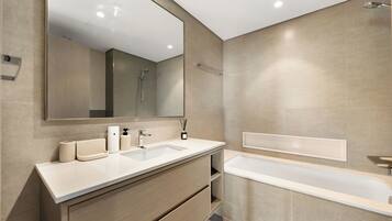 Separate bathtub and shower, hair dryer, towels