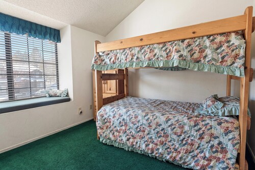 Pet-friendly lakefront condo with fireplace, community pool, hot tub + more!