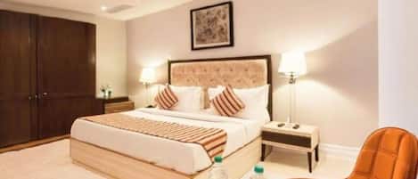 Premium bedding, memory-foam beds, desk, laptop workspace