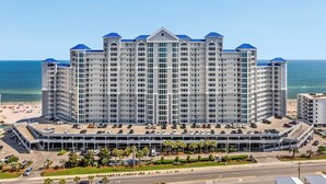A high-rise hotel with multiple floors, a parking garage, and a beach view. - Lighthouse #1109 – New owner - beachfront property renovated in 2026!” (Gulf Shores)