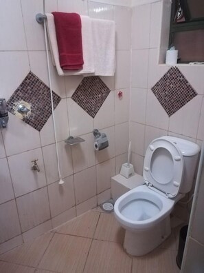 Standard Double Room, City View | Bathroom | Shower, slippers, towels, soap