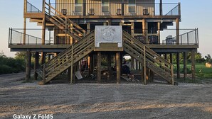 A multi-level wooden structure with a sign reading "Galaxy Z Fold5".