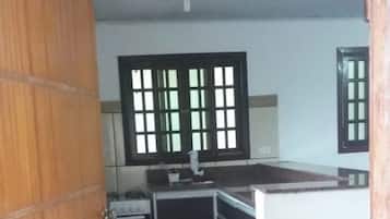 Basic House, Courtyard View | Private kitchen | Fridge, microwave