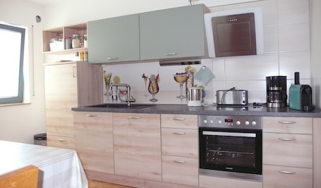 Fridge, microwave, oven, stovetop. Apartment in Former Bank Building with Balcony