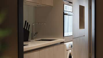 Apartamento | Cozinha privada | Geladeira, micro-ondas, fogão, cooktop