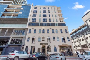 A multi-story building with a sign reading "The Valour." - The Valour 702 (Cape Town)