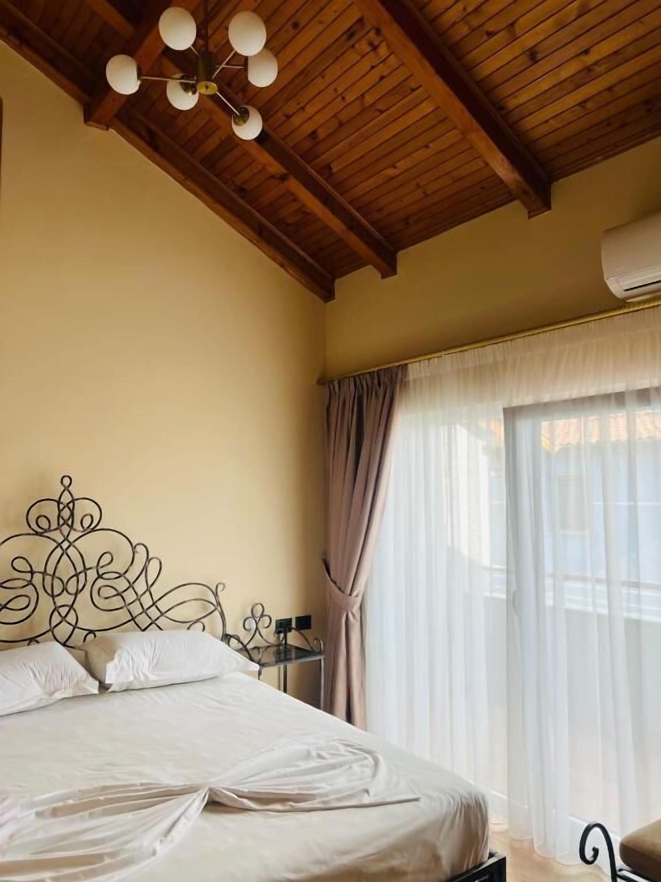 Deluxe Quadruple Room, Balcony | Hypo-allergenic bedding, minibar, desk, blackout drapes