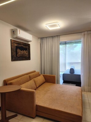 Apartamento conforto, vista para o jardim | Sala de estar