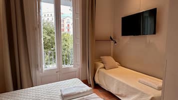 Family Triple Room, Balcony, City View | In-room safe, free WiFi
