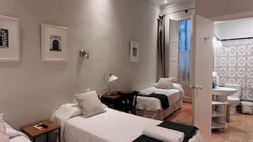 Economy Triple Room, Courtyard View | In-room safe, soundproofing, free WiFi