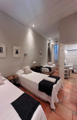 Economy Triple Room, Courtyard View | In-room safe, free WiFi