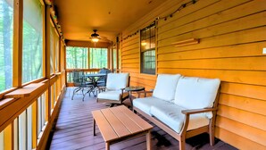 A wooden deck with a sofa, chairs, and a table. - Private Ellijay Cabin Sleeps 6 - Loft, Stone Fireplace, Trails & Lake Nearby (Ellijay)