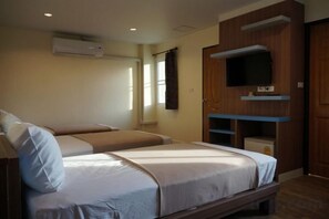 A hotel room with a bed, a television, and a window. - Samsen Sam Place (Bangkok)