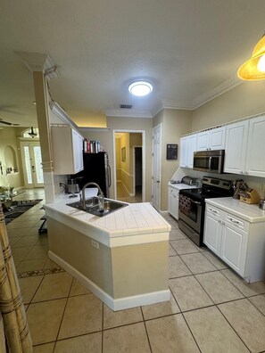 Fridge, microwave, oven, stovetop - Entire Place 
Family Getaway w/ Pool & Game Room (Poinciana)