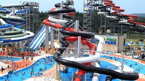 A water park with multiple slides and pools. - Awara Onsen Mimatsu (Awara)
