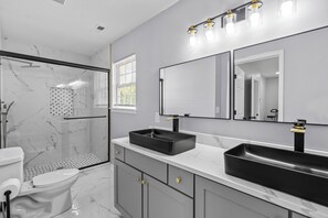 Shower, hair dryer, towels, soap