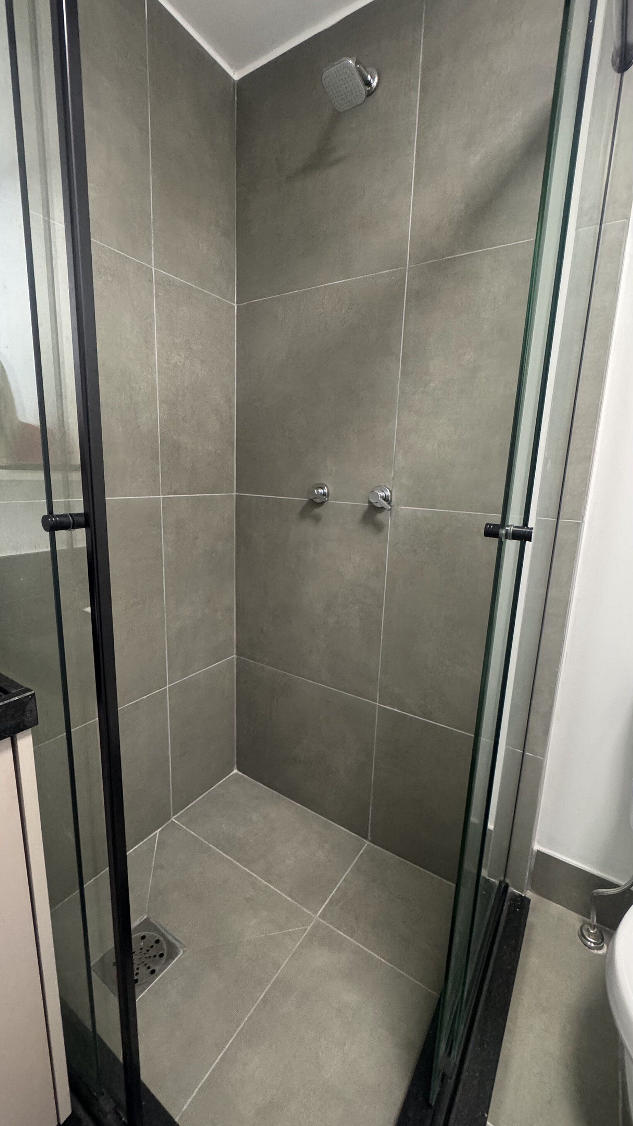 Basic Studio | Bathroom | Shower, hair dryer, towels, toilet paper