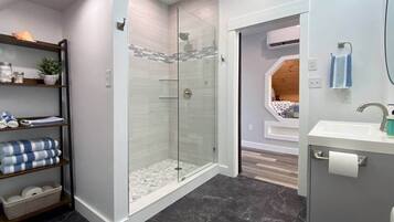 Shower, hair dryer, towels, shampoo