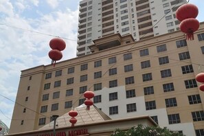 A multi-story hotel with a flat facade, numerous windows, and red lanterns. - Sunway Resort Suites @ Sunway Lagoon by Landmark (Subang Jaya)