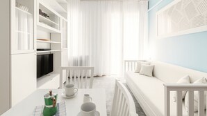 Een moderne, minimalistische woonkamer met een witte bank, een eettafel met witte kopjes en een tv op een wit kastje.