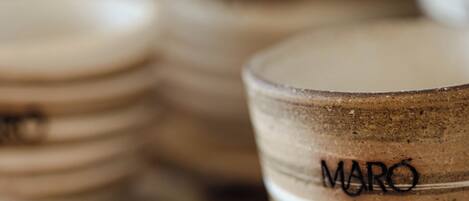 A stack of wooden coasters with the word "MARO" engraved on one.