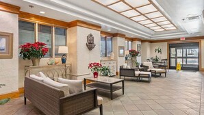 A spacious lobby with a high ceiling, large windows, and comfortable seating areas. - 1BR Oceanview Condo, Ocean Forest Plaza,High Floor (Myrtle Beach)