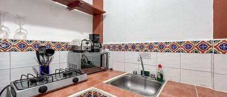 Fridge, microwave, stovetop, coffee/tea maker