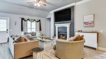 TV, fireplace, books