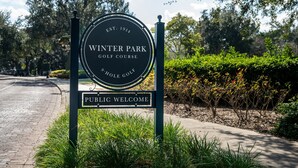 A sign for Winter Park Golf Course with a public welcome message. - Charming Remodeled Cottage | Walk to Park Ave (Winter Park)
