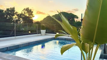 3 outdoor pools, open 8:00 AM to 10:30 AM, pool umbrellas, pool loungers