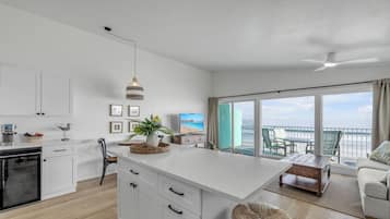 Deluxe Condo, Beach View | Living area | TV, DVD player