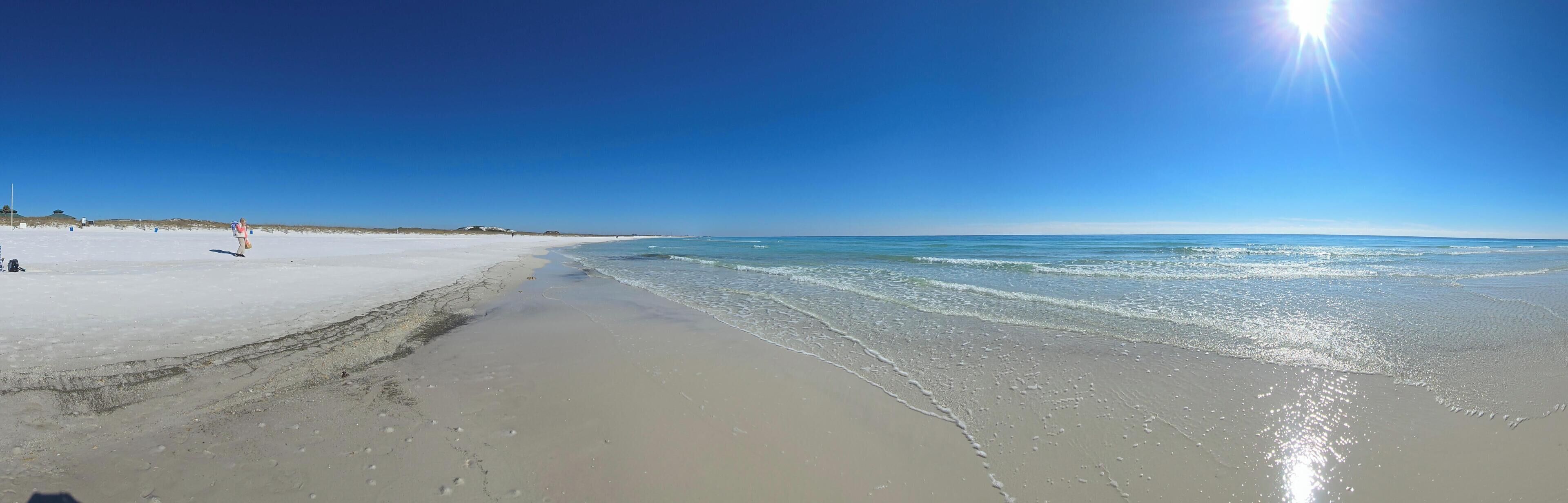 A beach with clear skies and calm water.