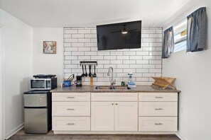 Fridge, microwave, stovetop, coffee/tea maker