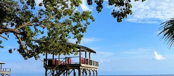 Royal Palm Hacienda Beach front home with private dock on Treasure Beach Utila