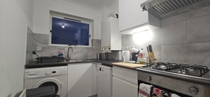 Deluxe Apartment, 2 Bedrooms, Private Bathroom, Courtyard View | Private kitchen | Espresso maker, coffee/tea maker, electric kettle, high chair