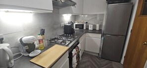 Deluxe Apartment, 2 Bedrooms, Private Bathroom, Courtyard View | Private kitchen | Espresso maker, coffee/tea maker, electric kettle, high chair