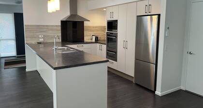 Modern home in Mapua Village, close level walk to Mapua wharf and cafes.