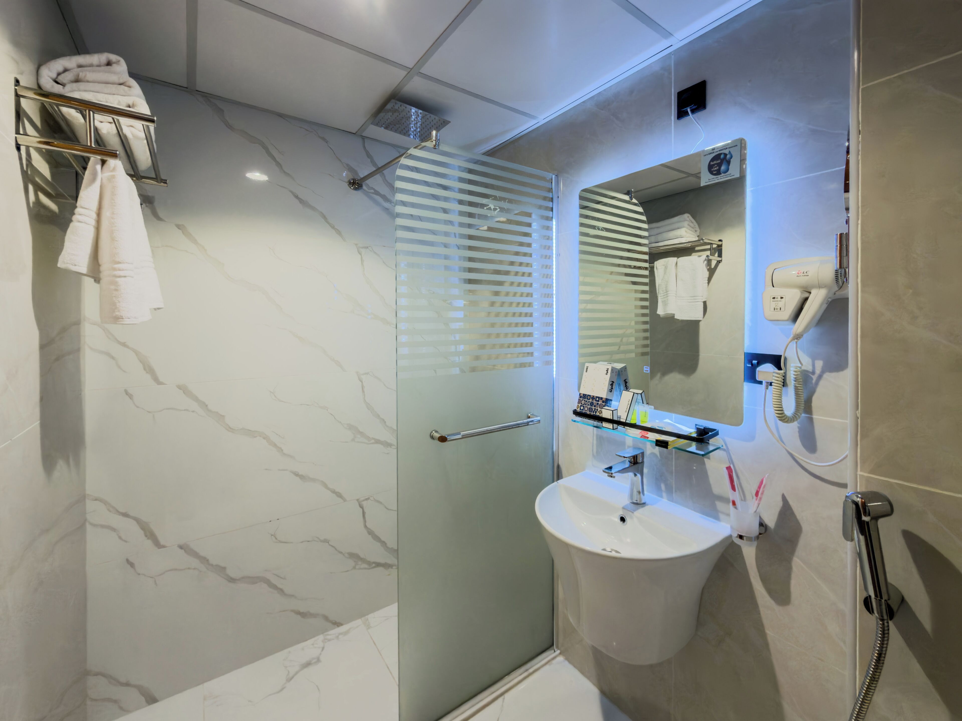 Combined shower/tub, hair dryer, towels, soap