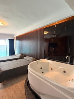 Superior suite, bubbelbad, uitzicht op zee | Een kluis op de kamer, verduisterende gordijnen