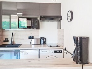 Fridge, microwave, cookware/dishes/utensils