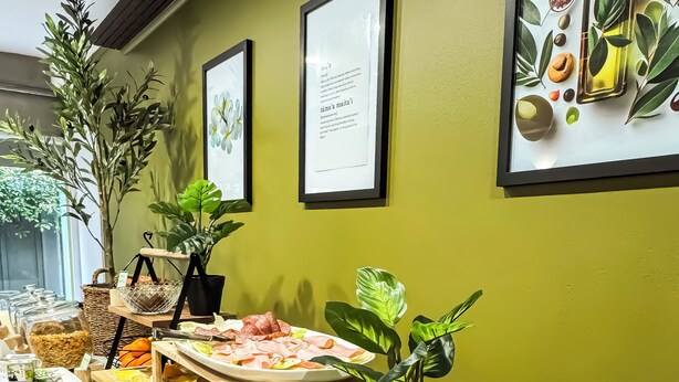 A buffet setup with various food items and a sign indicating 'Wheatmeal & White Toast'. - Noa Hotel (Auckland)